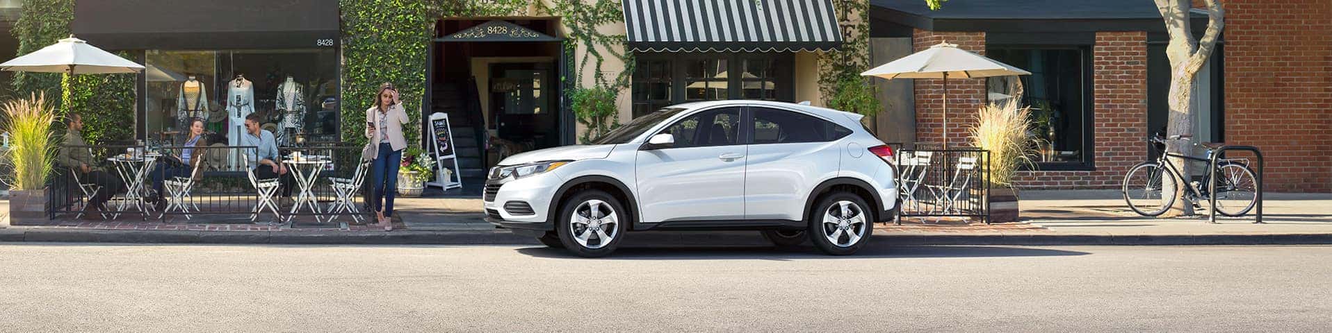 Boch Honda West is a Family Owned Dealership near Westford, MA | White MY19 Honda HRV parked outside cafe
