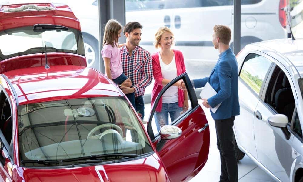 Salesman Showing Family Car