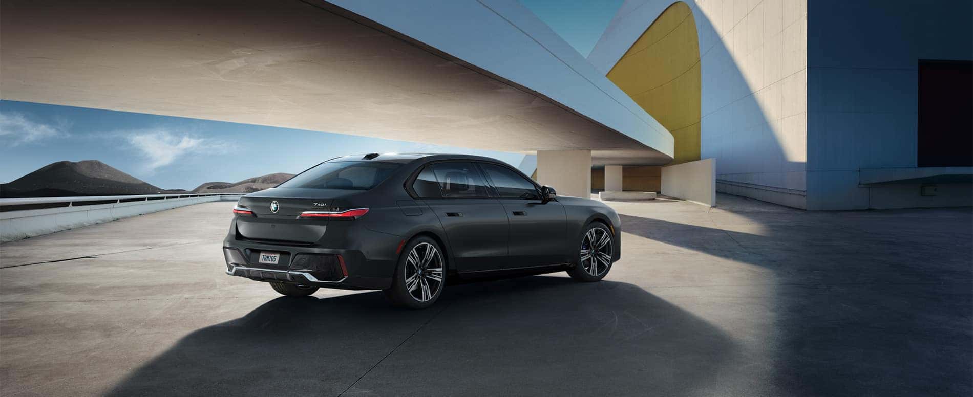 rear view of 7 series in front of futuristic background