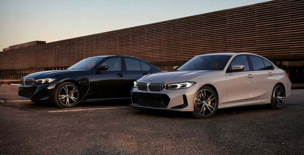 A black and white 2023 BMW 3 Series at dusk