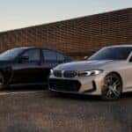 A black and white 2023 BMW 3 Series at dusk