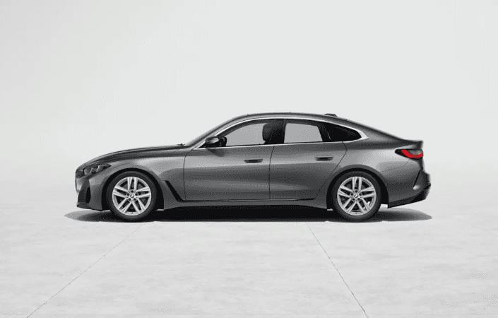 Side profile of a gray 2026 BMW 4 Series Gran Coupe parked in a studio setting.