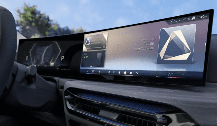 2026 BMW 4 Series Gran Coupe interior featuring a wide curved digital display and modern dashboard design.