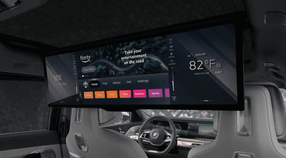 Rear entertainment screen in the BMW i7 displaying streaming and vehicle info.