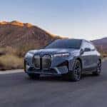 2025 BMW iX driving on the highway