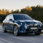 2026 BMW iX driving on the highway