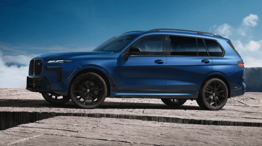 2026 BMW X7 M60i in blue shown in side profile, BMW of Northwest Arkansas.
