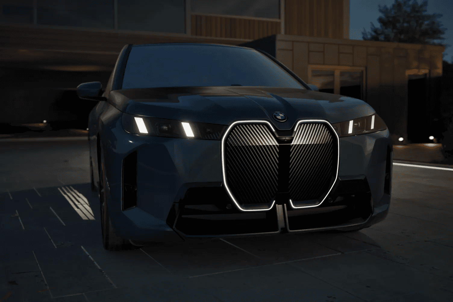 2026 BMW iX parked at night outside