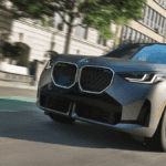 2026 BMW X3 driving in the city
