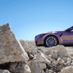 2027 BMW M4 siude angle parked on rocks