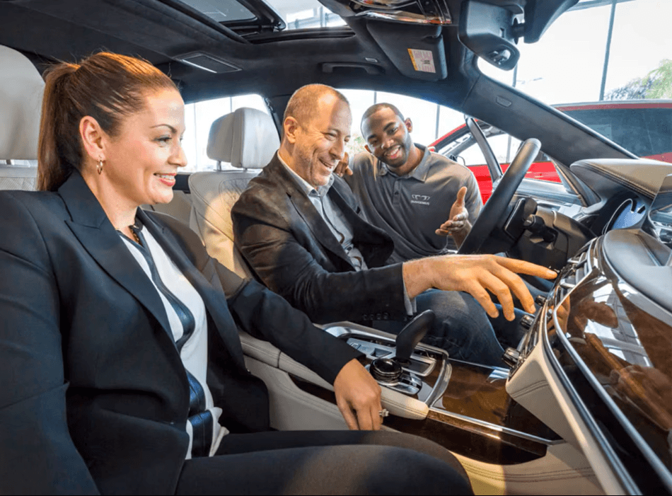 BMW Genius showing a customer the interior of a Certified Pre-Owned BMW Models