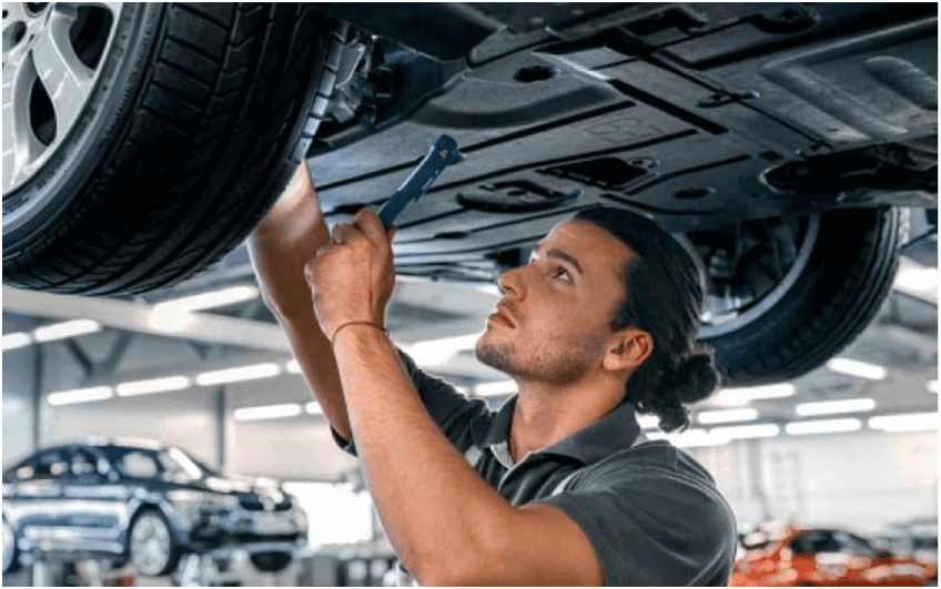 BMW Certified technician inspecting vehicle