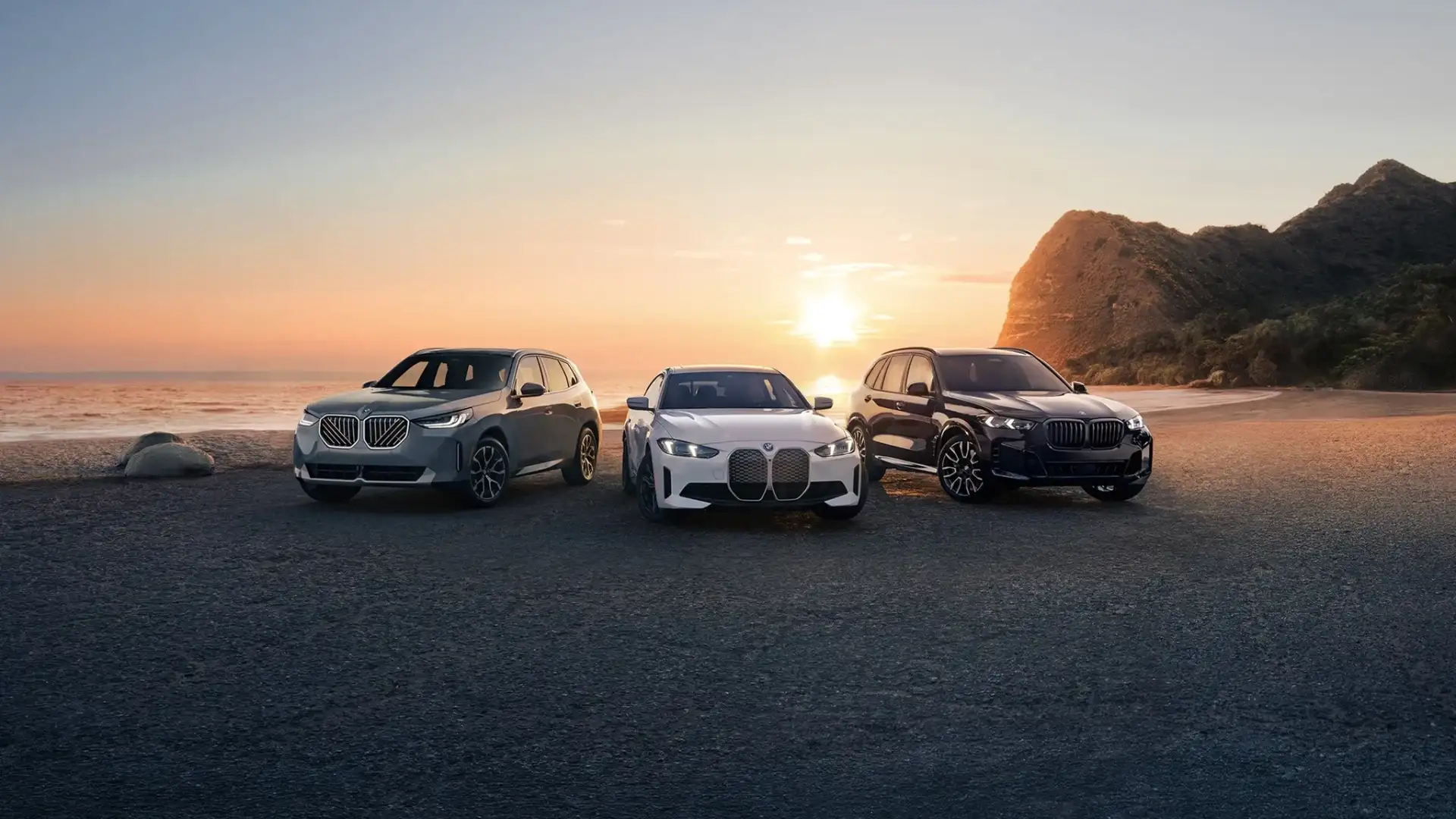 The BMW lineup at sunset — Sport Activity Vehicle, i4 electric Gran Coupe, and Sport Activity Vehicle — the range serviced at BMW of South Atlanta in Union City, GA.