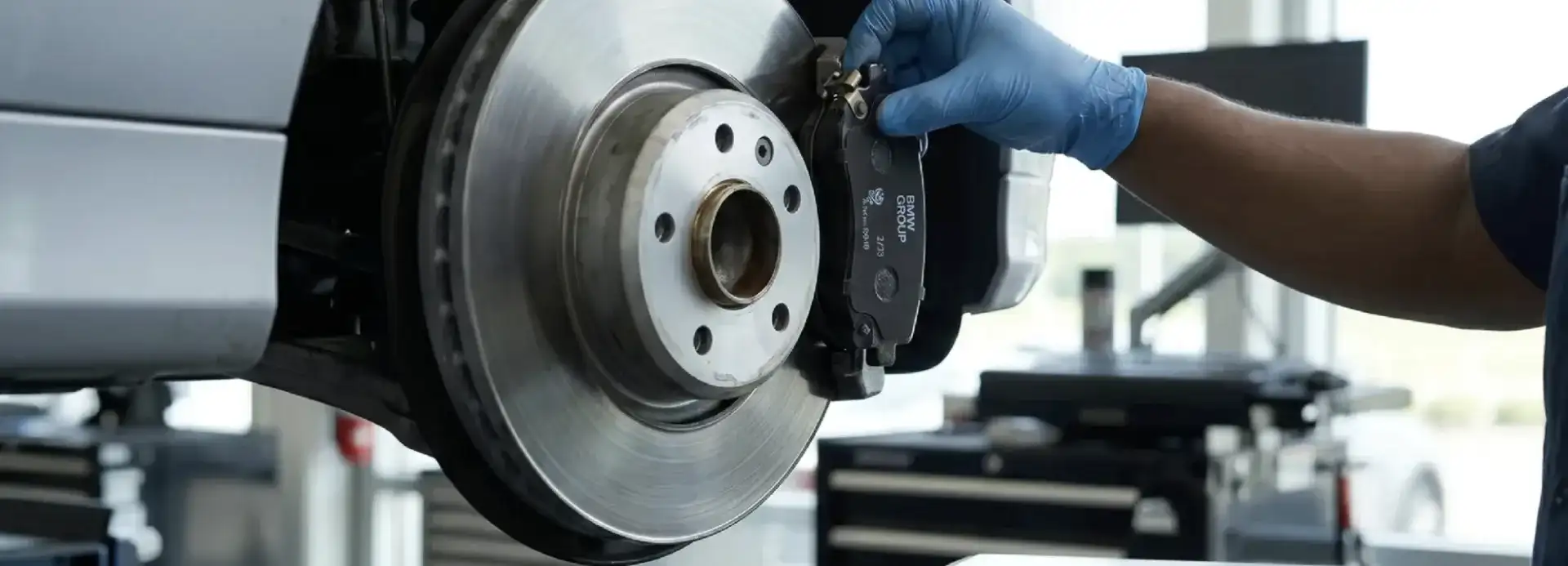 BMW technician replacing brake pads at BMW of South Atlanta