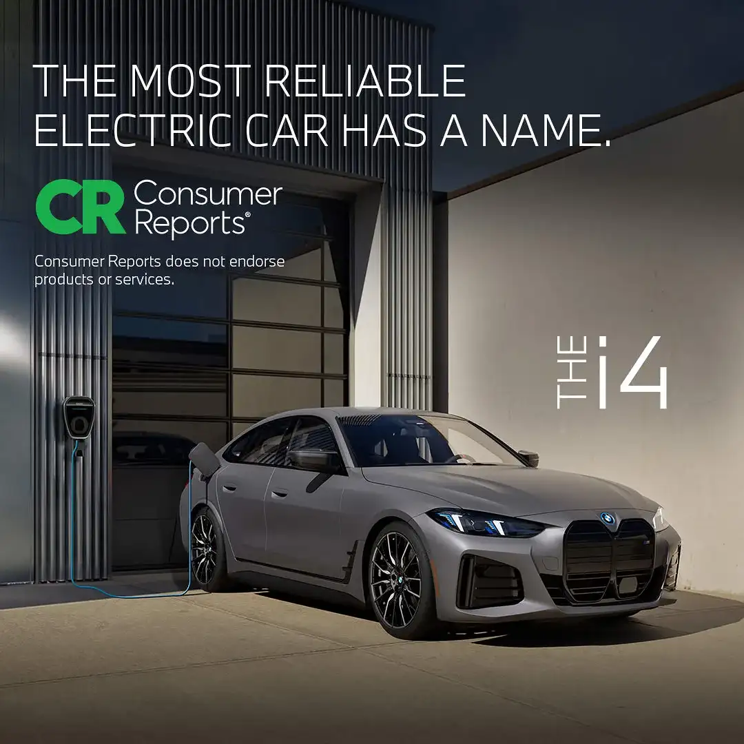 BMW × Consumer Reports: 'The most reliable electric car has a name' — the BMW i4 charging at a home Wallbox