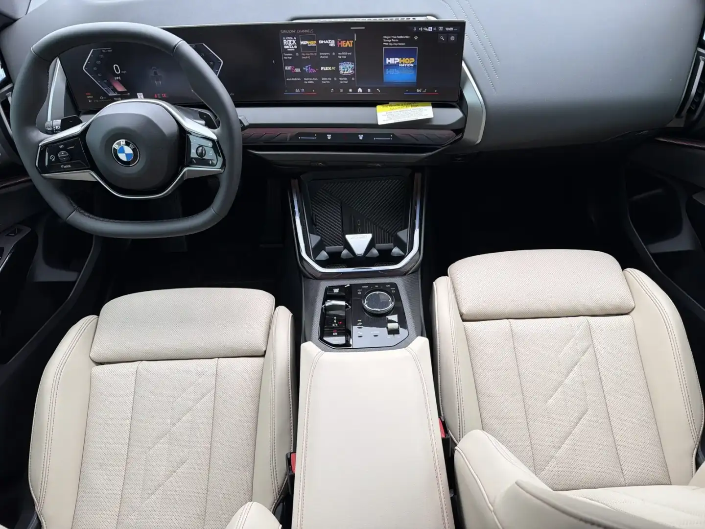 2026 BMW X3 cabin in oyster leather with the BMW Curved Display