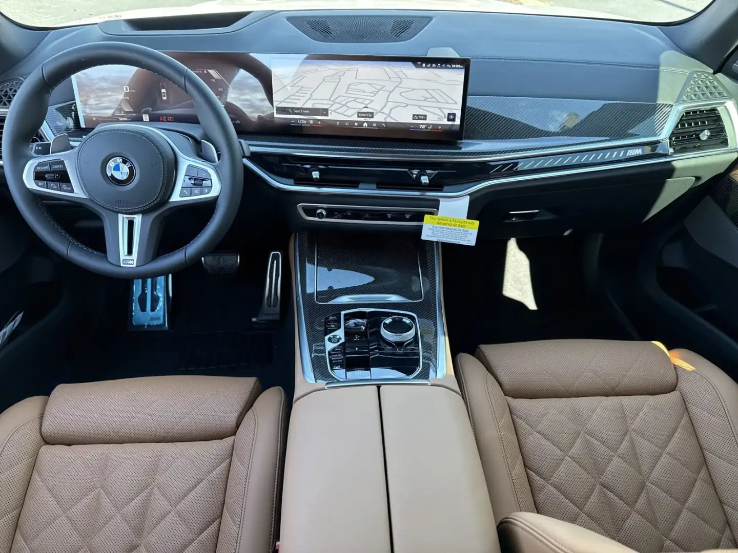 X5 M60i cabin in cognac quilted leather with carbon fiber trim
