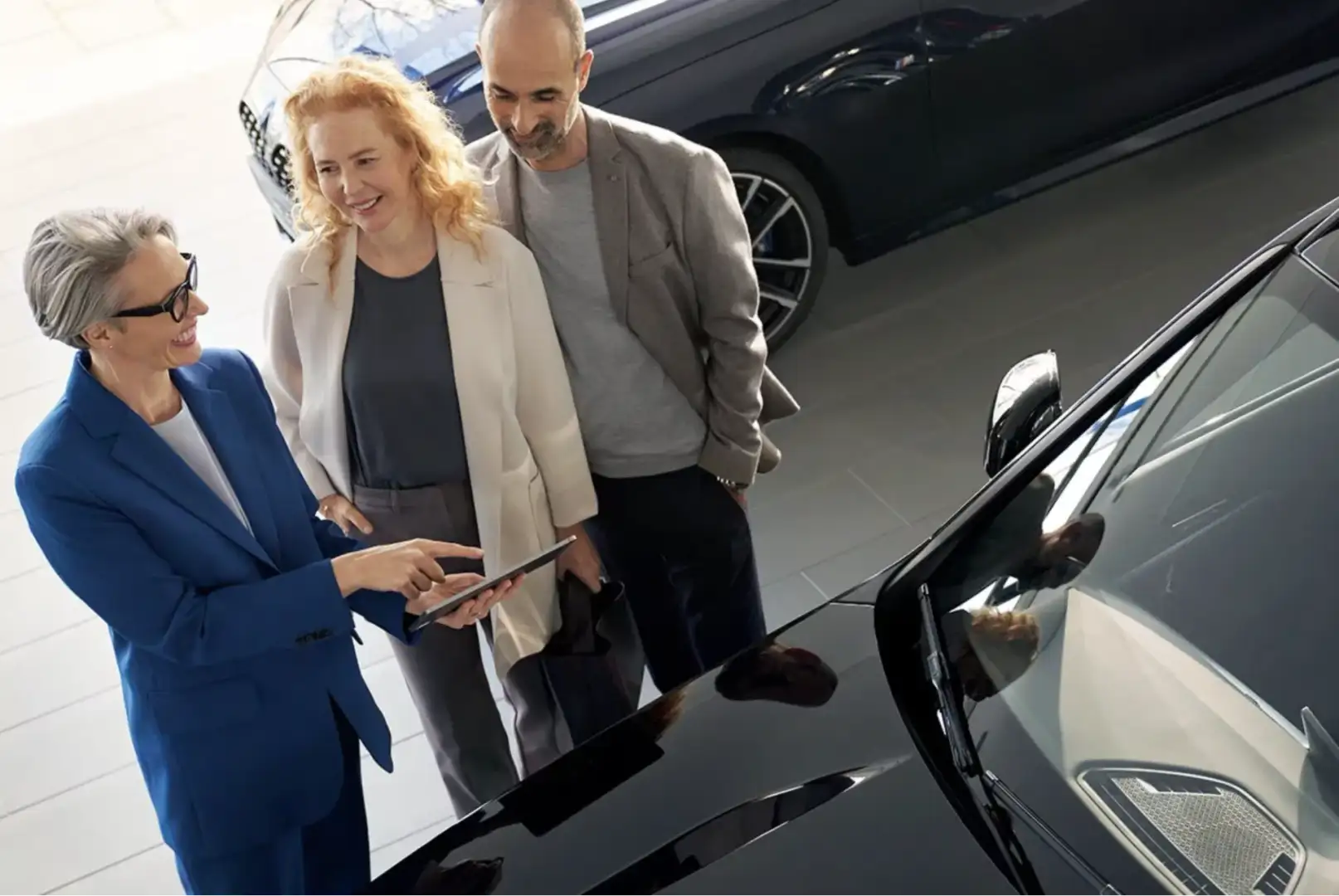 A BMW sales associate shows financing details