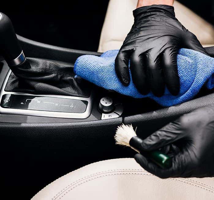 Where do I begin the process of trading in a vehicle at Boch Automotive of Massachusetts | Man deatiling the interior of a car Where do I begin the process of trading in a vehicle at Boch Automotive of Massachusetts | Man deatiling the interior of a car