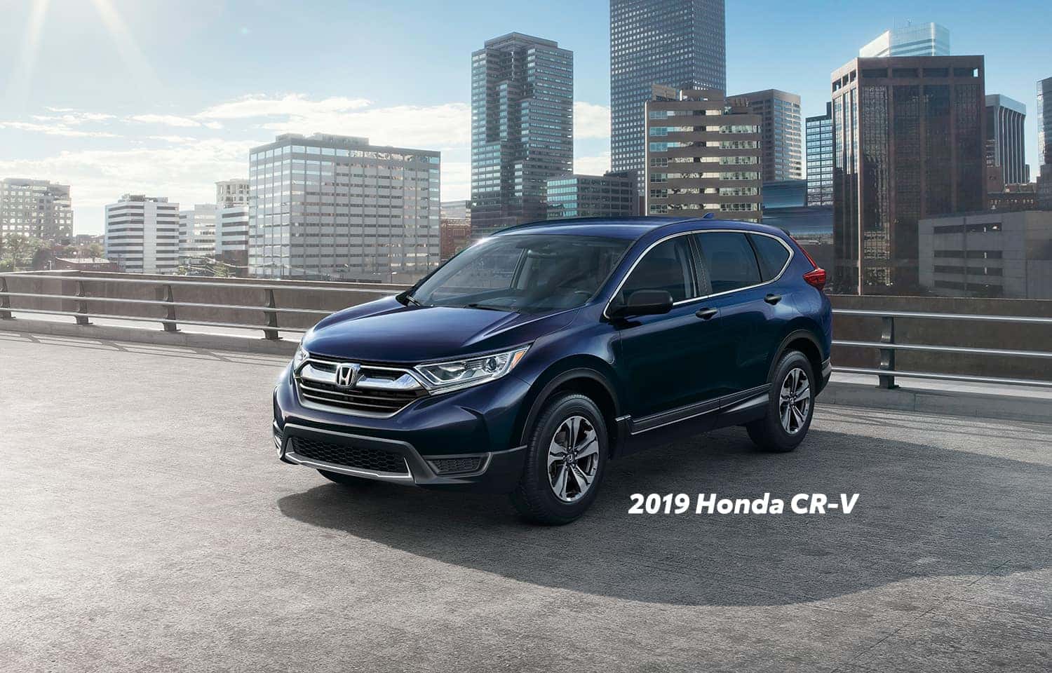 Comparison of the 2019 Pilot versus 2019 CR-V at Boch Honda of Norwood | Midnight blue 2019 Honda CR-V parked in a parking lot Comparison of the 2019 Pilot versus 2019 CR-V at Boch Honda of Norwood | Midnight blue 2019 Honda CR-V parked in a parking lot