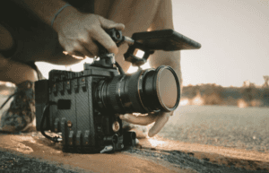 man filming a movie