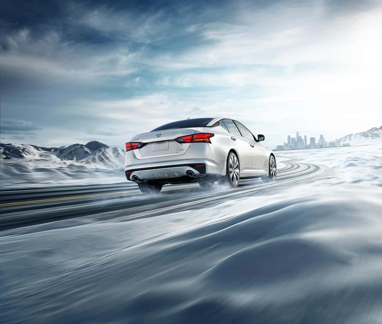 Model Features of the 2020 Nissan Altima at Boch Nissan of Norwood | white nissan altima driving in the snow