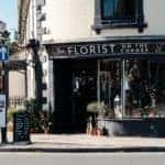 A lively flower shop on a street corner.