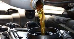 Oil being poured into an engine