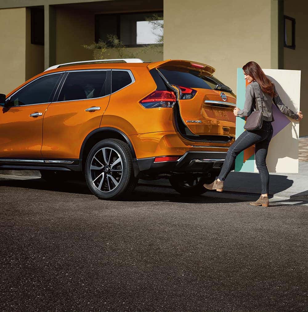 2019 Rogue performance features at Boch Nissan South in North Attleboro | Woman opening the trunk of the orange 2019 tucson using the car sensor 2019 Rogue performance features at Boch Nissan South in North Attleboro | Woman opening the trunk of the orange 2019 tucson using the car sensor