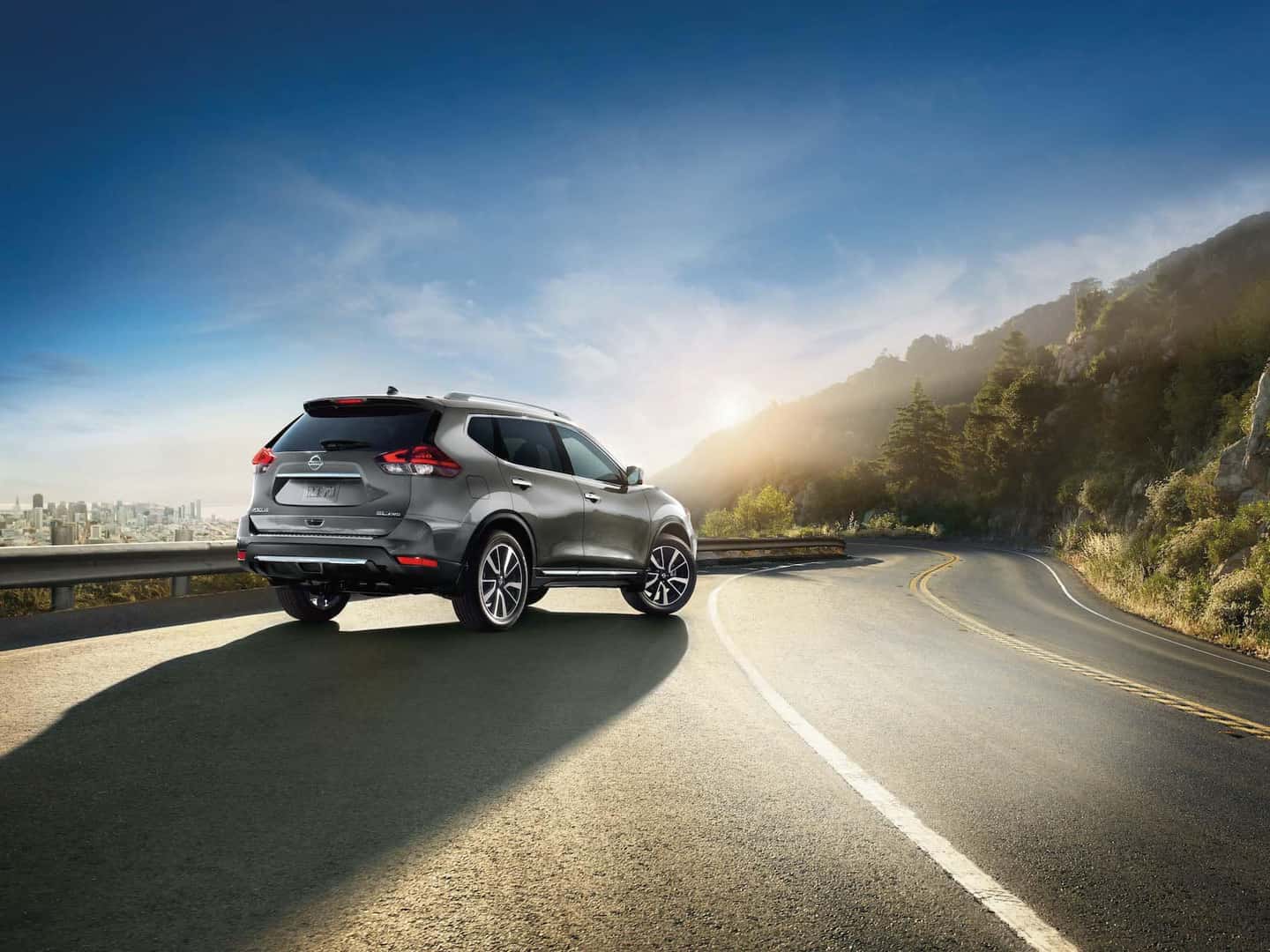 The 2020 Rogue model features at Boch Nissan South in North Attleboro | Grey 2020 rogue parked up the hill