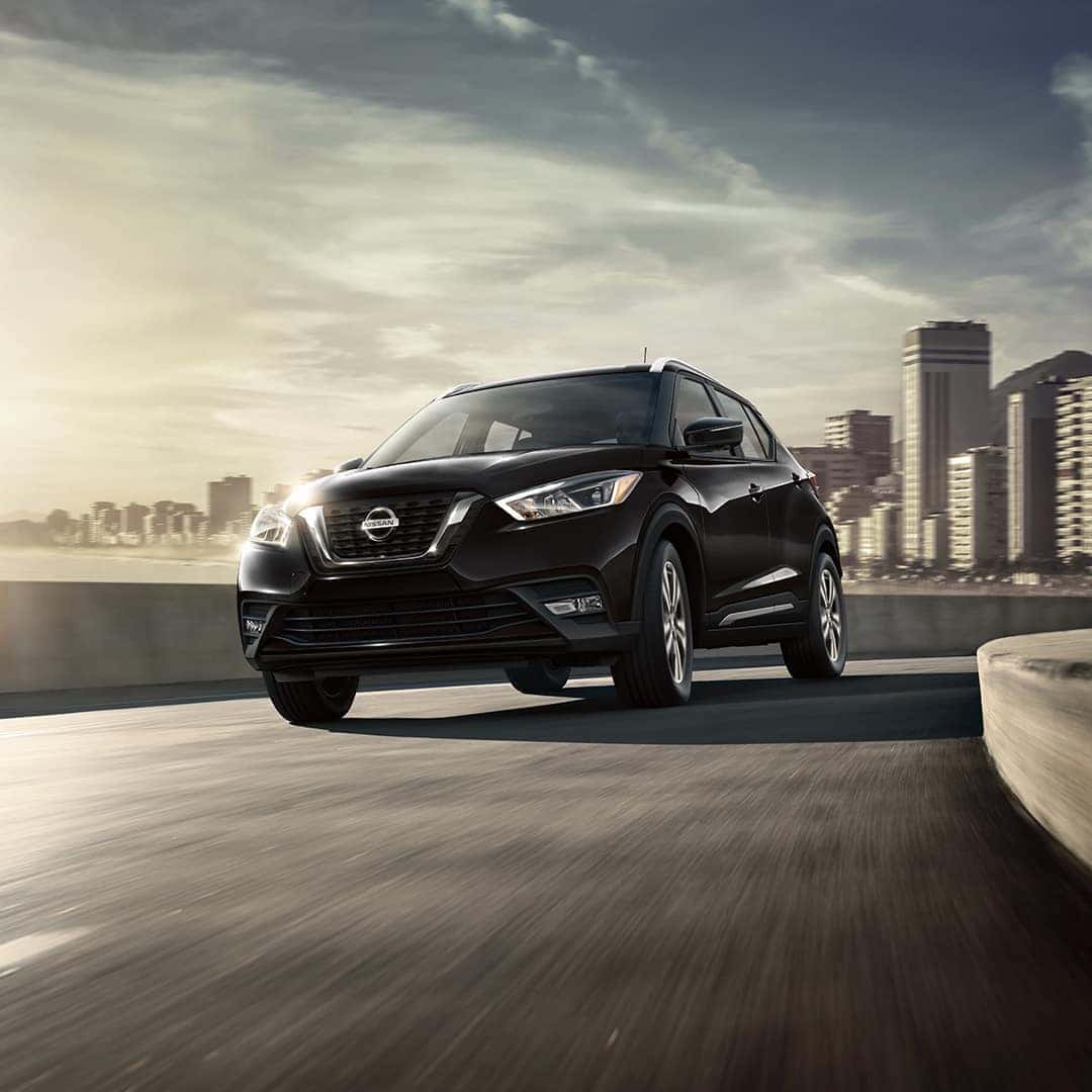 Boch Nissan South is a Nissan Dealer Near Plainville MA | Black 2020 Nissan Kicks Driving Away from City