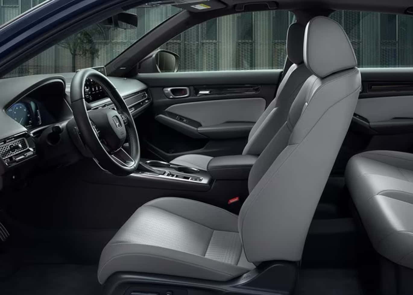 Honda Civic interior image of the drivers seat and steering wheel
