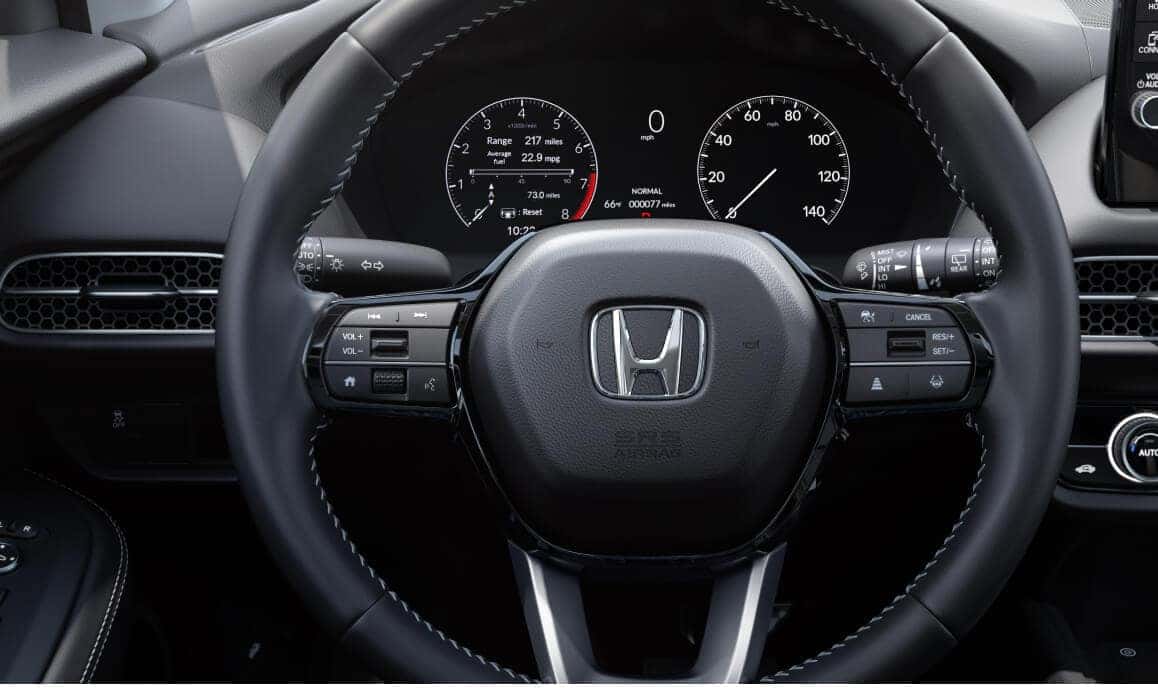 Honda HR-V LX highlighting its multifunction steering wheel and driver information display.