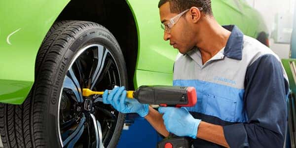mechanic changing tire
