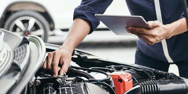 mechanic inspecting car engine
