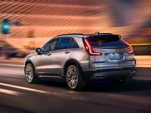 2024 Cadillac XT4 driving down the road