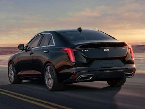 2024 Cadillac CT4 rear view of car driving on a road