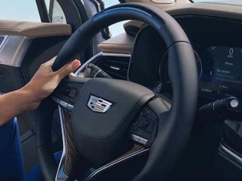 2024 Cadillac XT6 close up view of woman holding steering wheel