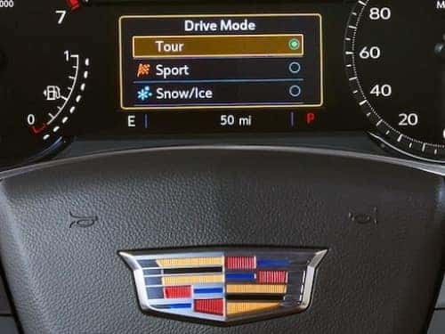 2024 Cadillac XT5 close up view of drivers dash showing drive mode screen