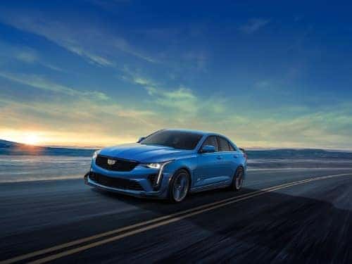 2024 Cadillac CT4-V driving fast on a blacktop road