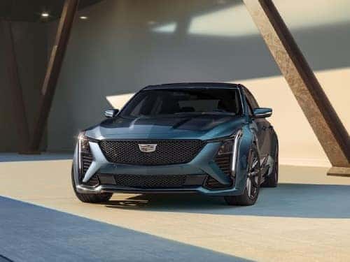 2024 Cadillac CT5 exterior front view parked next to a modern building
