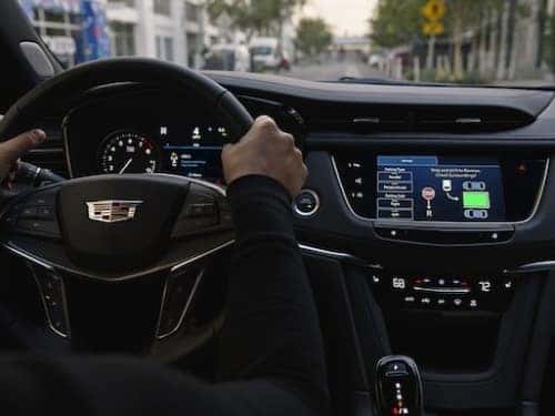 2025 Cadillac XT5 view of dash with parking assist feature on touchscreen