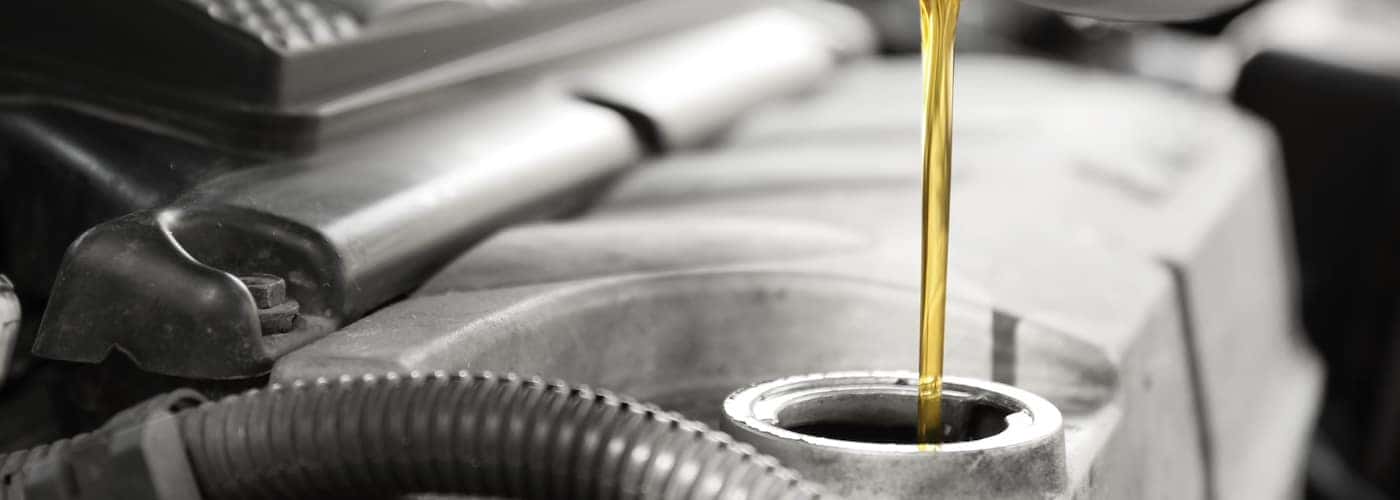 oil being poured into vehicle close up