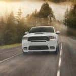2020 dodge durango white exterior driving through forest