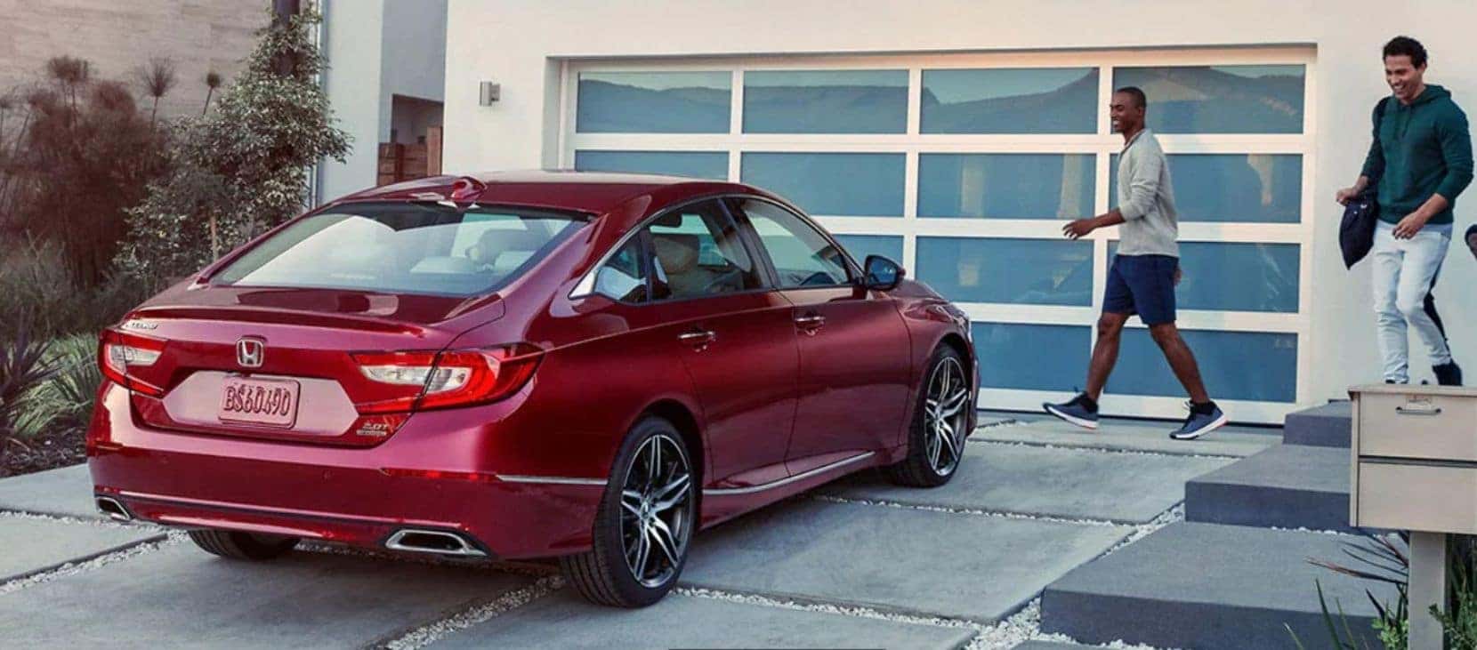 Red Honda Accord with 2 men approaching it to go for a drive