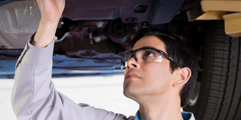 Technician Checking Oil on Mazda Vehicle