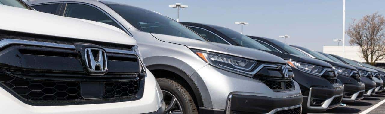 Exterior view of Nalley Honda Brunswick dealership showcasing a variety of Honda cars available for lease.