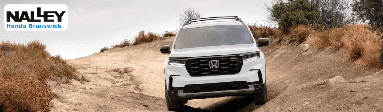 Close-up of Trail Torque AWD and lifted suspension on the Honda Pilot TrailSport 2025 model