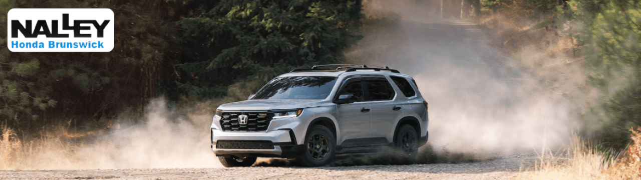 2025 Honda Pilot parked in front of Nalley Honda Brunswick dealership in Glynn County, GA