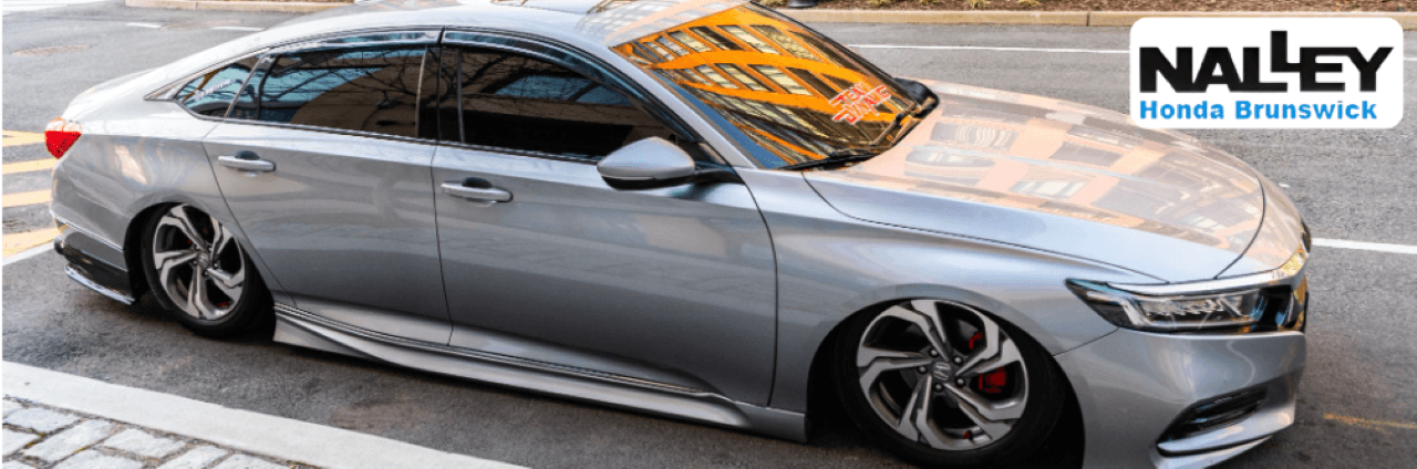 The 2024 Honda Accord parked outside Nalley Honda Brunswick showcases its sleek, modern design